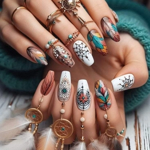 Bohemian press-on nails with colorful feather designs and 3D dreamcatcher charms