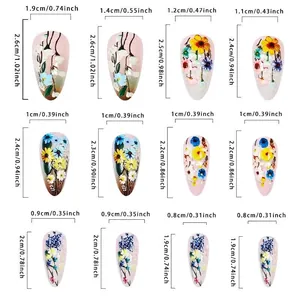 Size chart for daisy almond press-on nails showing 12 different floral false nail dimensions