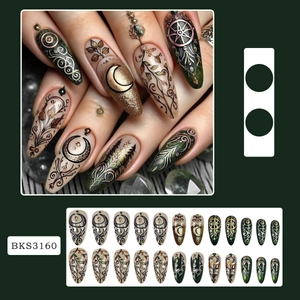 Press-on nails featuring mandala moon designs in emerald green and champagne gold stiletto shape