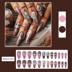 Bohemian style press-on nails featuring mandala leaf and feather patterns in almond shape
