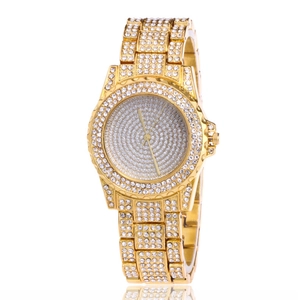 Close-up of gold-plated quartz watch featuring full rhinestones on band and dial