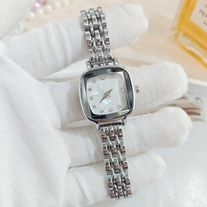 Detailed macro view of square mother of pearl watch dial with crystal hour markers