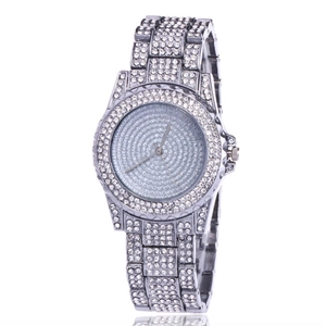 Detailed close-up of a silver ladies watch fully encrusted with sparkling rhinestones