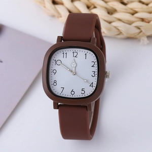 Detail of square quartz watch featuring a clear white dial and brown matte silicone strap