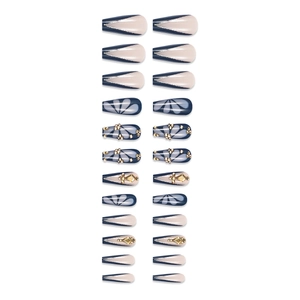 Sparkly butterfly press-on nails in long coffin shape with navy blue and nude pink colors