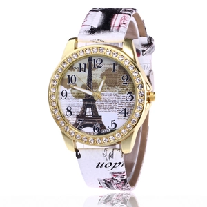 Women's quartz watch with gold diamond bezel, Eiffel Tower dial, and white leather strap