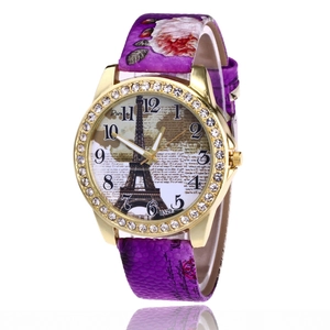 Detailed view of women's vintage watch with Eiffel Tower dial and purple floral strap