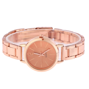 Detail of rose gold quartz watch with minimalist dial and metal link bracelet band
