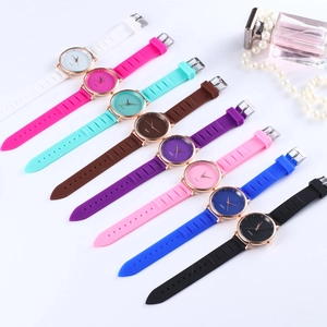 Flat lay of ultra-thin silicone quartz watches in various colors with rose gold cases