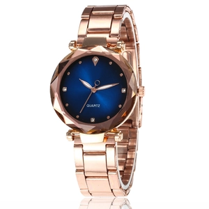 Women's quartz watch with rose gold metal band and blue faceted prism glass dial