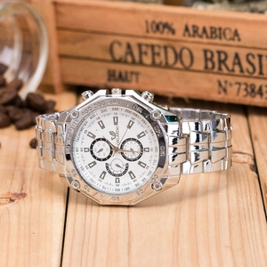 Silver stainless steel business watch with white dial set on wooden table with coffee beans