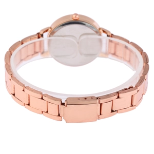 Detail view of the rose gold metal link strap and folding clasp on a women's watch