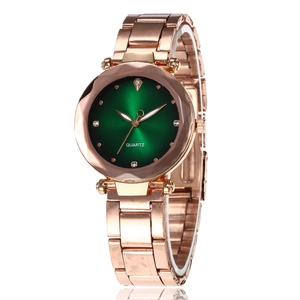 Elegant rose gold women's watch with green sunburst dial and crystal accents