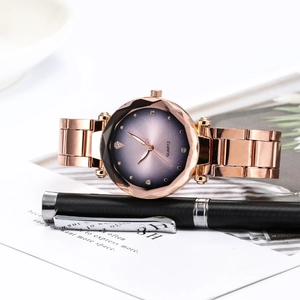 Close-up of women's quartz watch with starry purple dial and rose gold metal strap