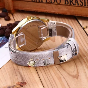 Detail of printed snakeskin watch strap with vintage patterns and stainless steel back