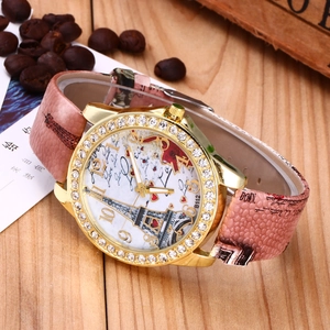Detail of pink snake pattern strap and Eiffel Tower dial with crystal bezel
