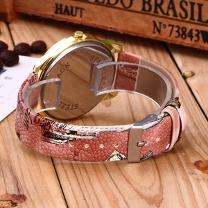 Detail of the stainless steel back case and pink patterned strap of women's quartz watch