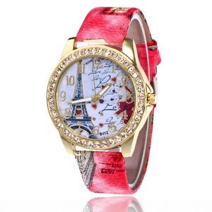 Gold Eiffel Tower watch for women with rhinestone bezel and pink patterned leather strap