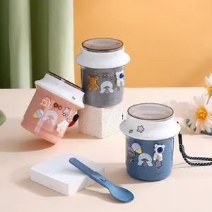 Three colorful insulated portable soup mugs with cartoon charms and a blue folding spoon