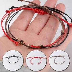 Adjustable woven bolo bracelets in black, red, and brown with metallic ring sliders