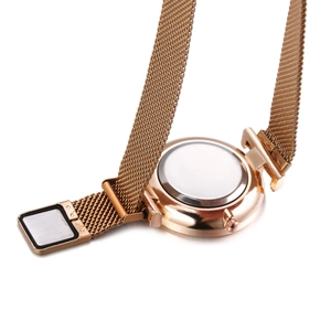 Detailed back view of rose gold watch with magnetic mesh strap and stainless steel case