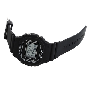 Detail view of a black digital sports watch with square dial and LED backlight display