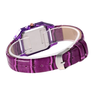 Detail of purple croc-embossed leather watch strap with stainless steel buckle on stand
