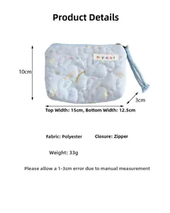 Detail showing blue quilted cinnamoroll pouch with zipper and dimensions label