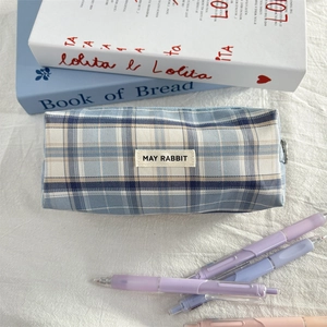 Close-up of the blue checkered pencil case featuring a May Rabbit fabric label