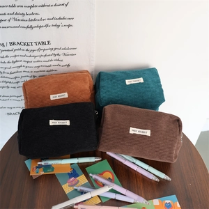 Detailed view of corduroy stationery bags in four colors with high quality zippers