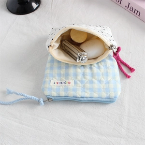 Quilted heart-patterned mini storage bags in polka dot and blue check for small items