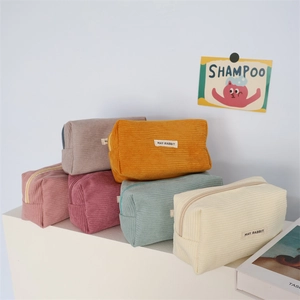 Medium corduroy stationery bags in multiple pastel colors like cream, yellow and green