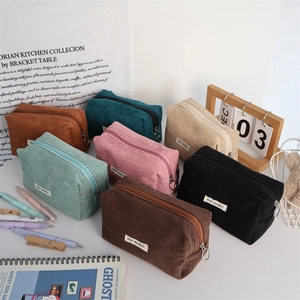 Detailed texture of corduroy storage bags in seven colors with metal ring zippers