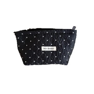 Portable black polka dot cosmetic bag with zipper and logo tag for travel storage