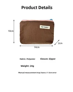 Detail view of a brown plaid nylon storage bag with dimensions 14x10x2cm and zipper