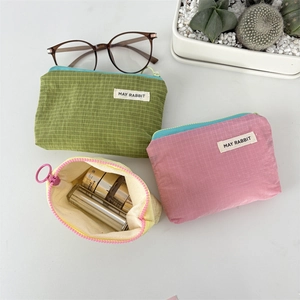 Waterproof plaid nylon organizer bags in green, pink, and beige for makeup and coins