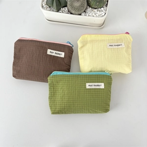 Waterproof nylon plaid storage pouches in brown, yellow and green with zip closures