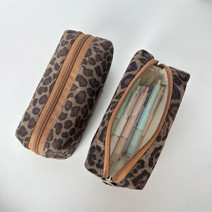 Close-up of leopard print canvas pencil case showing large capacity and zipper details