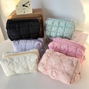 Quilted cloud cosmetic bag in multiple colors with metallic zip for makeup and skincare