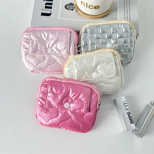 Quilted heart-patterned PU wallets in multiple colors shown with lifestyle accessories