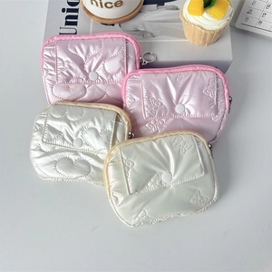 Quilted PU coin purse in pink and pearl white with heart and bow patterns