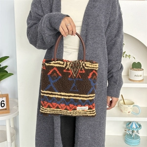 Detail of plush tote bag showing retro geometric pattern and soft lamb wool texture
