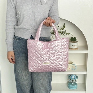 Pink heart quilted puffy handbag with glossy finish and logo label detail