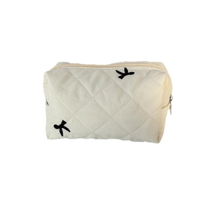 Quilted large capacity makeup bag in cream white with black bird embroidery patterns