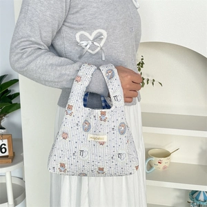 Quilted blue striped handbag with cartoon bear patterns and mayrabbit label detail