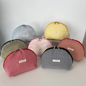 Collection of checkered shell makeup bags in seven colors with durable metal zippers