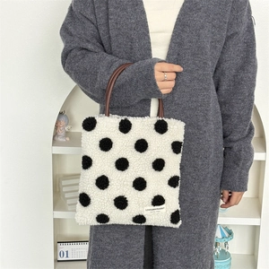 Winter plush tote bag with black polka dots and brown leather handles for women