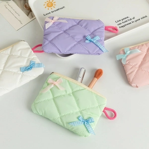 Quilted pastel makeup bags with cute bows and zip closure in lavender and mint