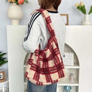 Detail of red and white plaid faux fur tote bag showing the soft texture and large capacity