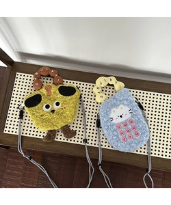 Close-up of cute cartoon plush crossbody bags with soft texture and textured rope straps